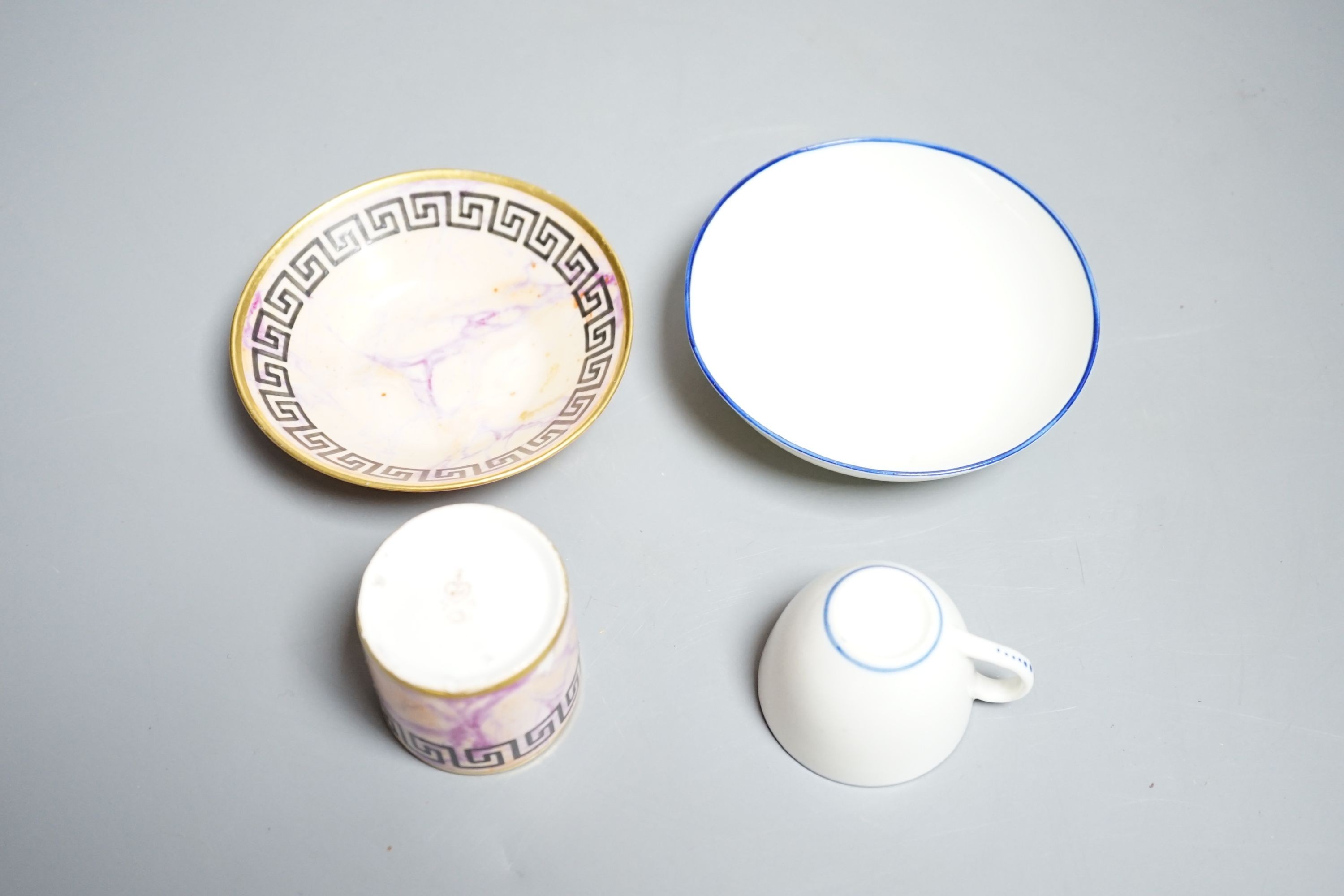 A Derby miniature coffee can and saucer, c.1800-10 and a Pinxton miniature teacup and saucer, c.1800. Provenance - Mona Sattin collection of miniature cups and saucers, collection no.s 112 & 114.